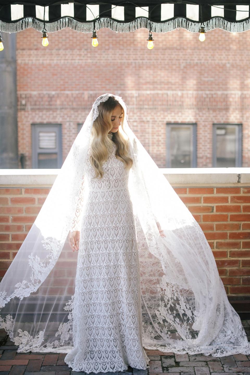 My Monvieve veil was made in Italy with delicate French lace. When you look closely, there are tiny pieces of crystal sewn into the lace, which caught the light as I moved.