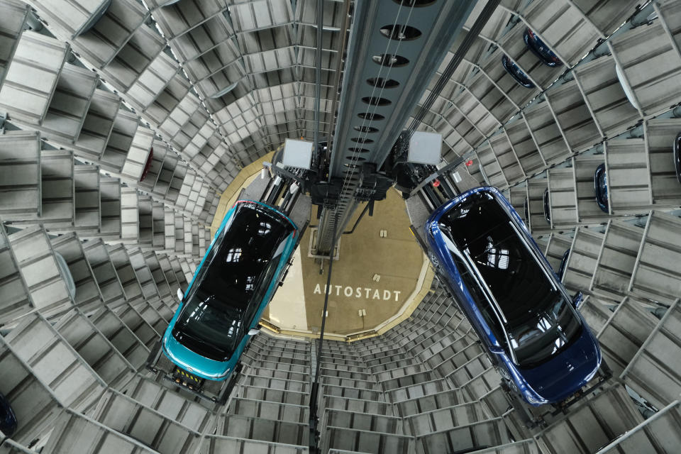 Volkswagen ID.4 (R) and ID.3 electric cars inside one of the twin towers used as storage at the Autostadt promotional facility next to the Volkswagen factory in Wolfsburg, Germany. Photo: Sean Gallup/Getty Images
