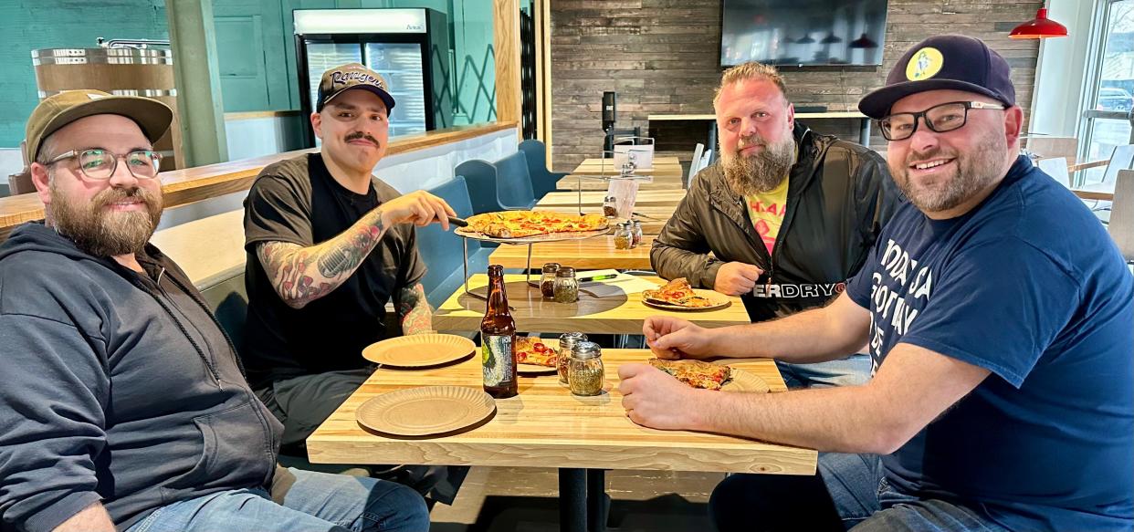 The Fourth Street Collective, left to right, Ryan Miller, Deli Ohio owner and Mike's Pizza co-owner; Mike Carvajal, Mike's Pizza co-owner; Micah Dorward, The Dorward Thinking Company, LLC owner; and Adam Longacre, UnHitched Brewing Company owner.