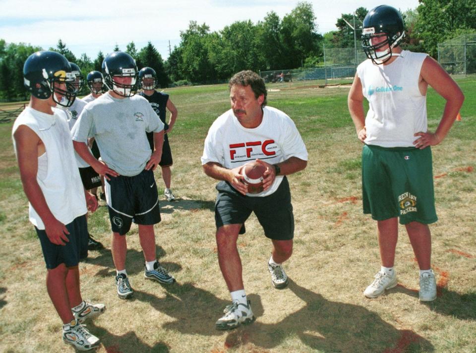 Mike D'Aloisio goes through plays during an Elmira Notre Dame preseason practice in 1999.