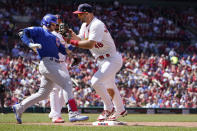 Chicago Cubs' Ian Happ, left, is forced out at first by St. Louis Cardinals first baseman Paul Goldschmidt during the seventh inning of a baseball game Sunday, June 26, 2022, in St. Louis. (AP Photo/Jeff Roberson)