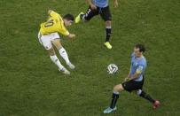 No. 6 - THE GOAL. Colombia's attacking midfielder James Rodriguez arguably overshadowed other players with consistently brilliant performances. His best moment came against Uruguay in the last 16 when the ball arched towards him 25 meters out. Rodriguez checked the positioning of the goalkeeper before chesting the ball down and, in one fluid movement, turning and firing a left-foot volley in off the underside of the crossbar. REUTERS/Felipe Dana/Pool