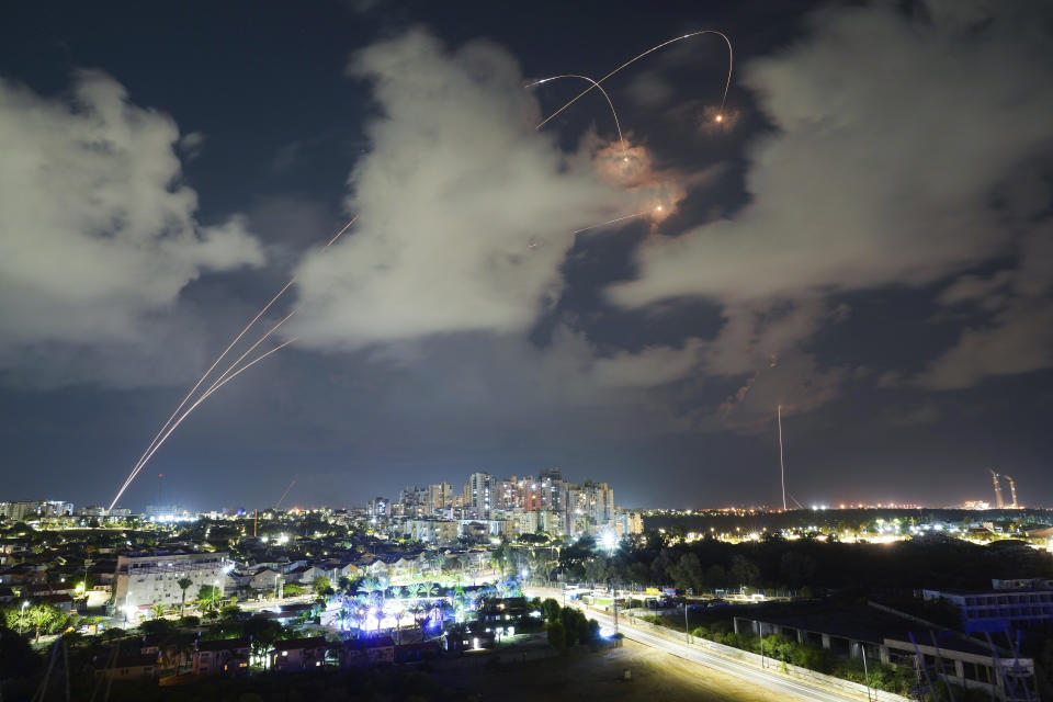 File - Rockets from the Israeli Iron Dome air defense system maneuver to intercept a rocket fired from the Gaza Strip, in Ashkelon, Israel, Thursday, Oct. 19, 2023. The fallout from the Israel-Hamas war has spilled into workplaces everywhere, with corporate leaders from the highest ranks of prominent companies weighing in with their views while workers complain of their own voices not being heard. (AP Photo/Tsafrir Abayov, File)