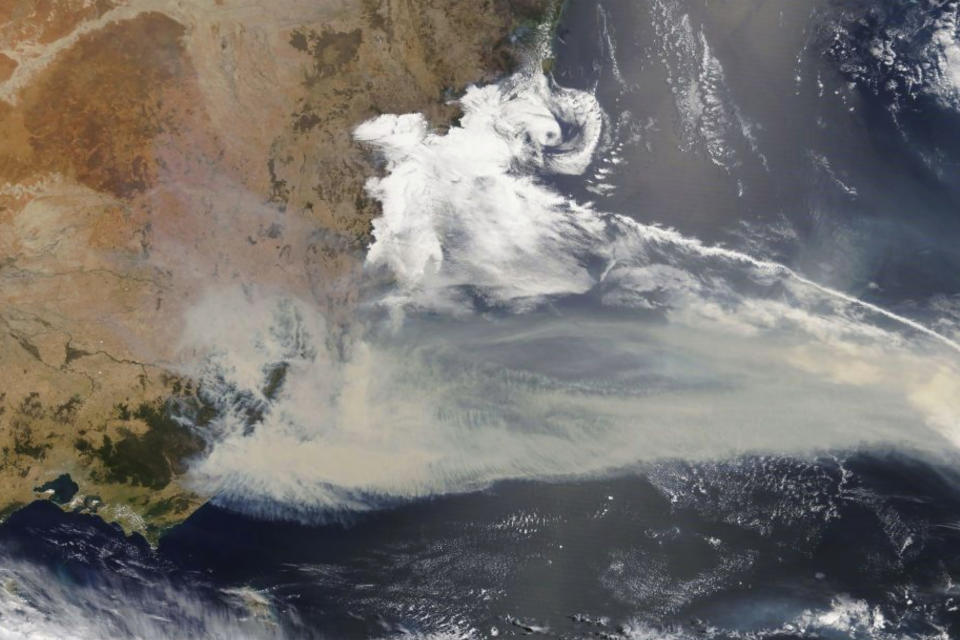 This Jan 2, 2020, photo captured by NASA's Terra satellite and made available by the Moderate Resolution Imaging Spectroradiometer (MODIS), shows thick smoke blanketing southeastern Australia along the border of Victoria and New South Wales. More than 200 fires are burning in Australia's two most-populous states. Blazes have also been burning in Western Australia, South Australia and Tasmania. (NASA via AP)