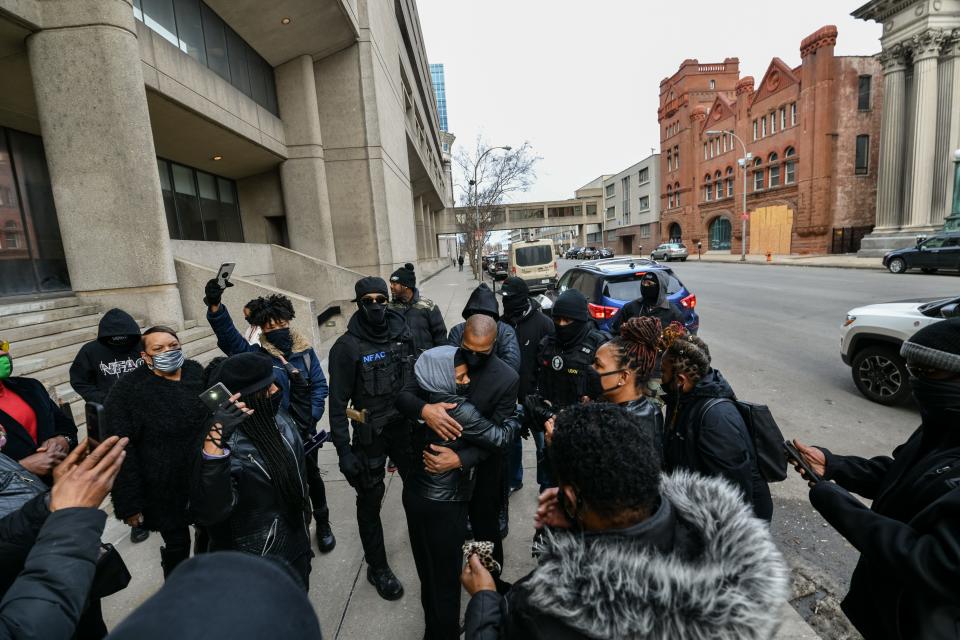 Grandmaster Jay greets members in front of the Hall of Justice in downtown Louisville on Feb. 26, 2021. Prosecutors say he aimed a rifle at law enforcement officers during a demonstration on Sept. 4, 2020.