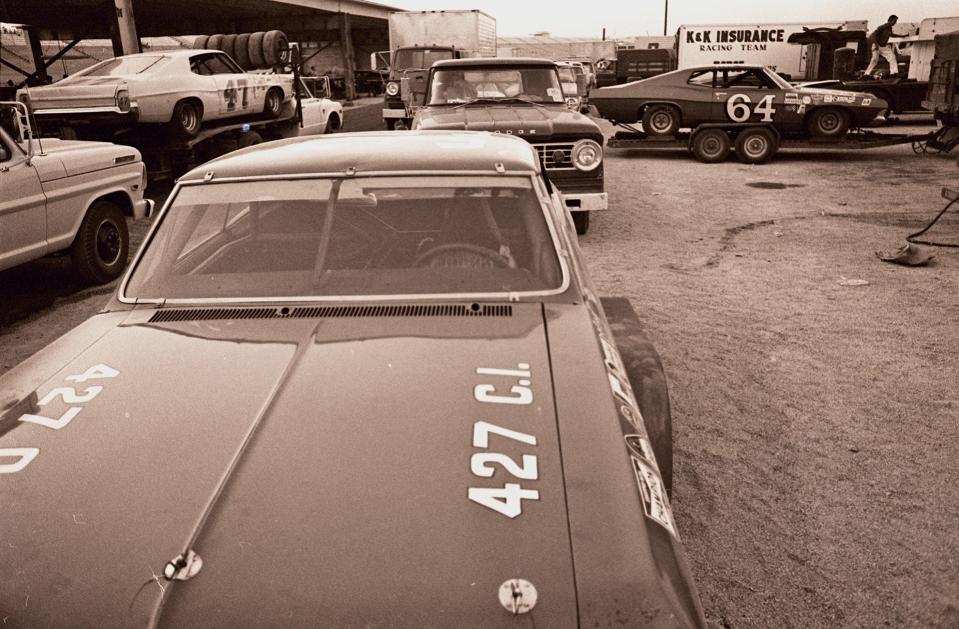 ** FILE ** The garage area at the Alabama International Speedway is crowded with loaded trucks and stock car racers after drivers withdrew from the inaugural race at the speedway in a dispute between NASCAR and members of the Professional Drivers' Association in this Sept. 13, 1969 file photo in Talladega, Ala. (AP Photo)