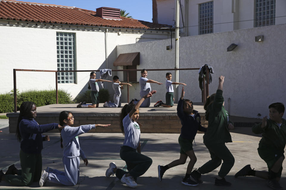 Students rehearse a dance at the St. Agnes Elementary School in Phoenix, Ariz., on March 3, 2020. In 2016, the student body at St. Agnes was two-thirds Hispanic; the figure is now 95%, and virtually every student receives financial aid through state-approved tax credit programs that extend to private schools. (AP Photo/Dario Lopez-MIlls)