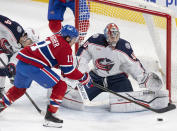 Columbus Blue Jackets goaltender Daniil Tarasov (40) makes a save against Montreal Canadiens' Brendan Gallagher (11) during the second period of an NHL hockey game Tuesday, March 12, 2024, in Montreal. (Christinne Muschi/The Canadian Press via AP)