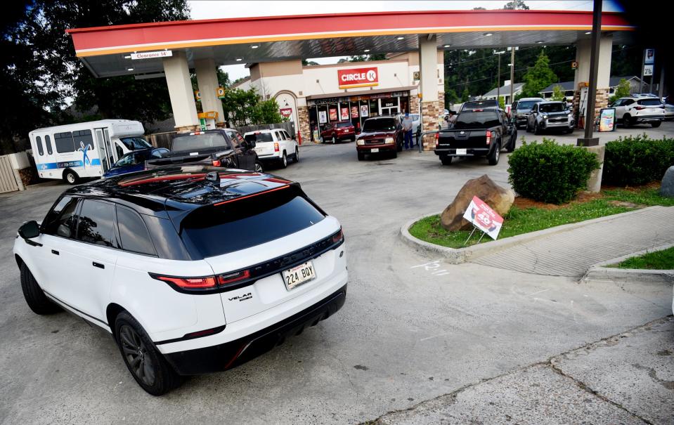 People wait in line for gas in the South Highland neighborhood on Friday, June 16, 2023. 