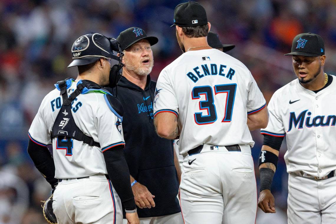 Miami Marlins pitching coach Mel Stottlemyre Jr. speaks to relief pitcher Anthony Bender (37) on the mound during the seventh inning of an MLB game against the Pittsburgh Pirates at LoanDepot Park in Miami, Florida, on Thursday, March 28, 2024. D.A. Varela/dvarela@miamiherald.com