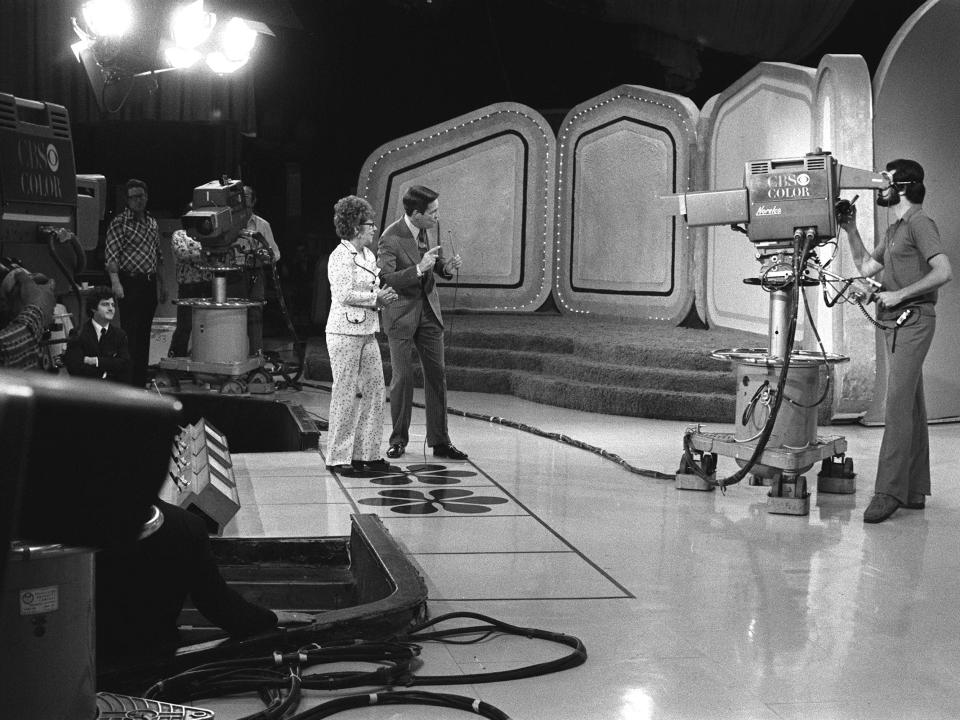 Bob Barker with a contestant on the set of The Price Is Right