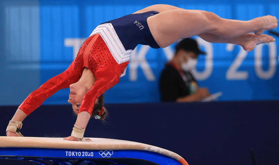 Grace McCallum flips on the vault with her hands on the vault during the all-around final