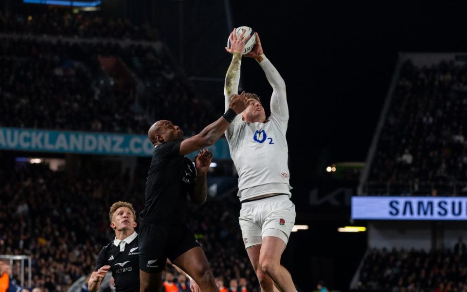 Tommy Freeman takes a kick against Mark Tele'a to score.