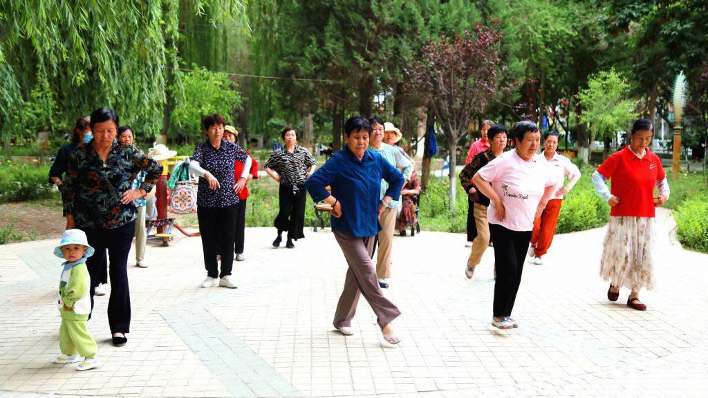 Women dancing at a square in Aksu prefecture, Xinjiang