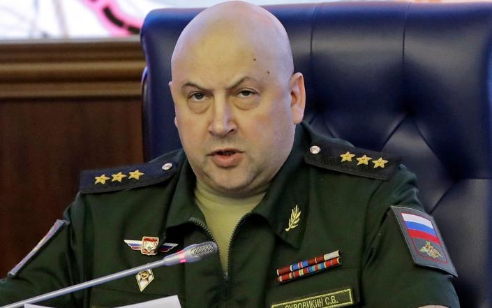 Colonel General Sergei Surovikin, Commander of the Russian forces in Syria, speaks, with a map of Syria projected on the screen in the back, at a briefing in the Russian Defense Ministry