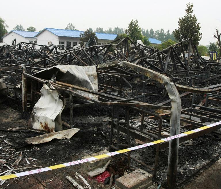 Charred bed frames are photographed after a fire broke out in a nursing home in Pingdingshan, in China's Henan province, on May 26, 2015