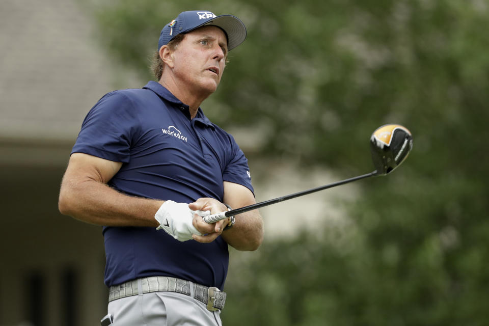 Phil Mickelson watches his tee shot on the 18th hole during the third round of the World Golf Championship-FedEx St. Jude Invitational Saturday, Aug. 1, 2020, in Memphis, Tenn. (AP Photo/Mark Humphrey)