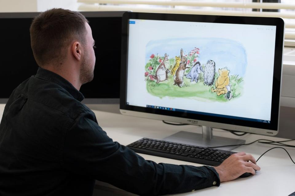 Royal Mint designer Daniel Thorne working on the design of the new Winnie the Pooh coin (Royal Mint/PA)