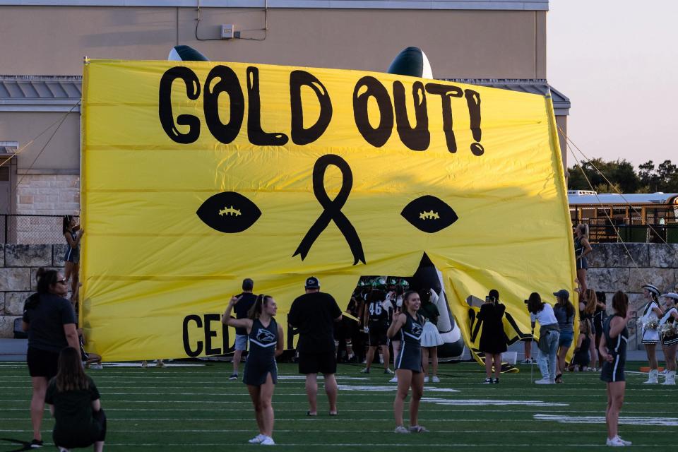 It was "Gold Out" night for Cedar Park football last Thursday, supporting childhood cancer victims. Former Cedar Park student Lance White created Lift Brigade, a foundation to held children with such challenges. Cedar Park won a nondistrict football game 28-24 over Round Rock at Gupton Stadium.