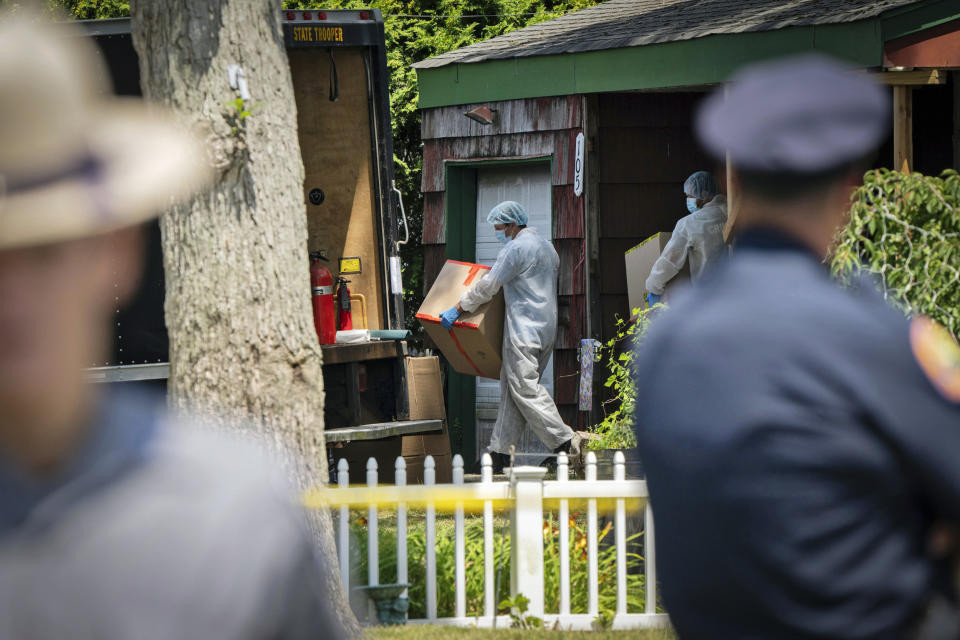 Crime lab officers removes boxes from the home of Rex Heuermann on July 15, 2023, in Massapequa Park, N.Y.  (Jeenah Moon / AP)