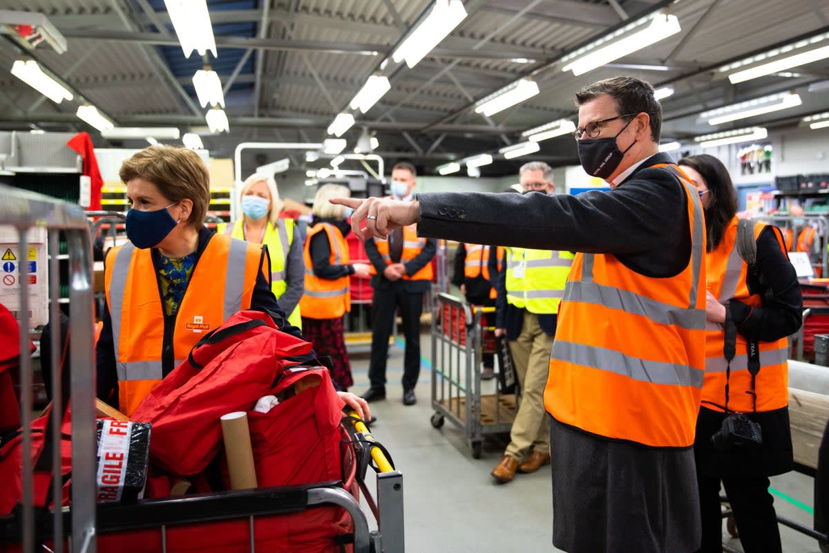 Simon Thompson (right) plans to step down from the role of CEO in October (Royal Mail/PA) (PA Media)