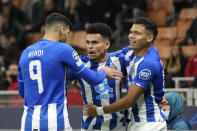 Porto's Luis Diaz, center, celebrates with his teammates after scoring his side's opening goal during the Champions League group B soccer match between AC Milan and Porto at the San Siro stadium in Milan, Italy, Wednesday, Nov. 3, 2021. (AP Photo/Luca Bruno)