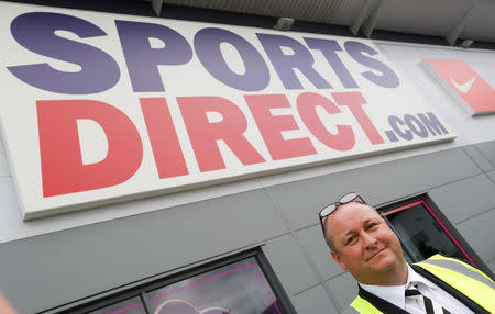 FILE PHOTO: Mike Ashley, founder and majority shareholder of sportswear retailer Sports Direct, leads journalists on a factory tour after the company's AGM, at the company's headquarters in Shirebrook, Britain, September 7, 2016. REUTERS/Darren Staples/File Photo