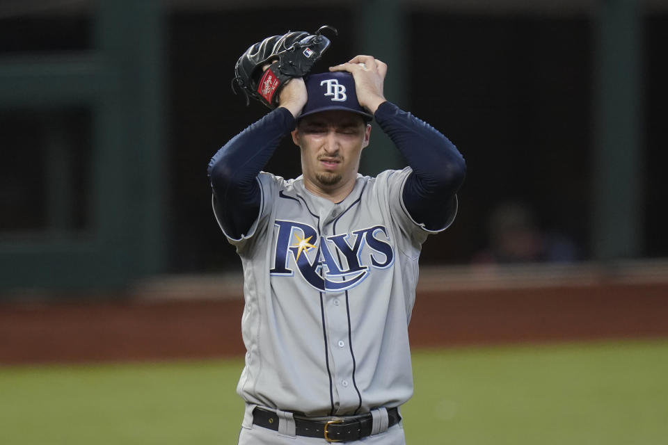 Tampa Bay Rays starting pitcher Blake Snell reacts after giving up two-run home run to Los Angeles Dodgers' Chris Taylor during the fifth inning in Game 2 of the baseball World Series Wednesday, Oct. 21, 2020, in Arlington, Texas. (AP Photo/Eric Gay)