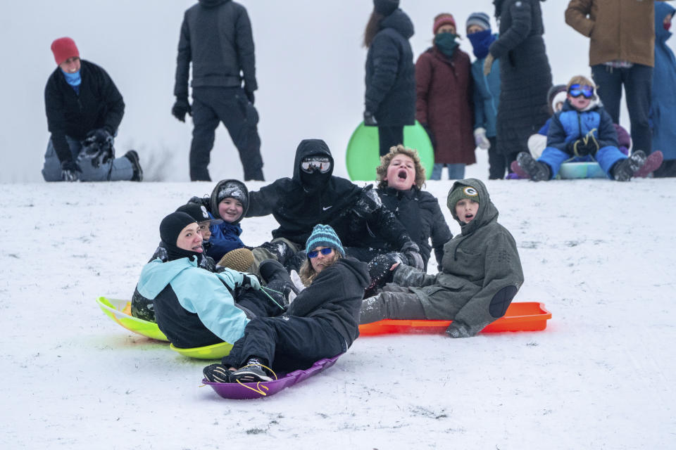 People gathered to sled at Clinton City Park next to Franklin High School in Southeast Portland, Ore., all day long Sunday, Jan. 14, 2024. (Mark Graves/The Oregonian via AP)