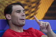 FILE - Spain's Rafael Nadal gestures in the team box after compatriot Spain's Jessica Bouzas Maneiro defeated Australia's Olivia Godecki in their Group D match at the United Cup tennis event in Sydney, Australia, Tuesday, Jan. 3, 2023. The 2023 Grand Slam season begins at the Australian Open next week. (AP Photo/Mark Baker, File)