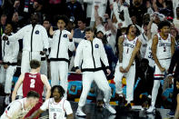UConn players celebrate during the second half of the NCAA college basketball game against Alabama at the Final Four, Saturday, April 6, 2024, in Glendale, Ariz. (AP Photo/Ross D. Franklin)