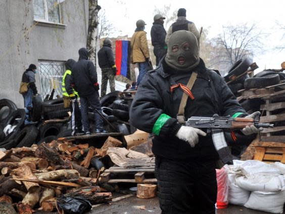 Armed pro-Russia protesters stand guard in Slavyansk, eastern Ukraine (Getty)