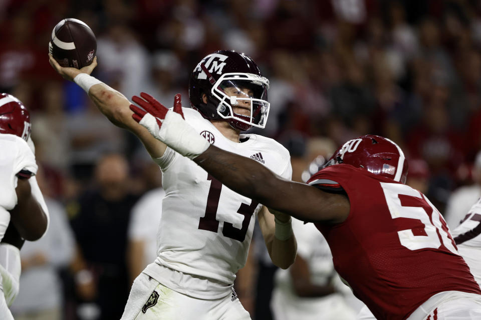 Oct 8, 2022; Tuscaloosa, Alabama; Texas A&M Aggies quarterback Haynes King (13) throws a pass against Alabama Crimson Tide defensive lineman Tim Smith (50) during the second half at Bryant-Denny Stadium. Butch Dill-USA TODAY Sports