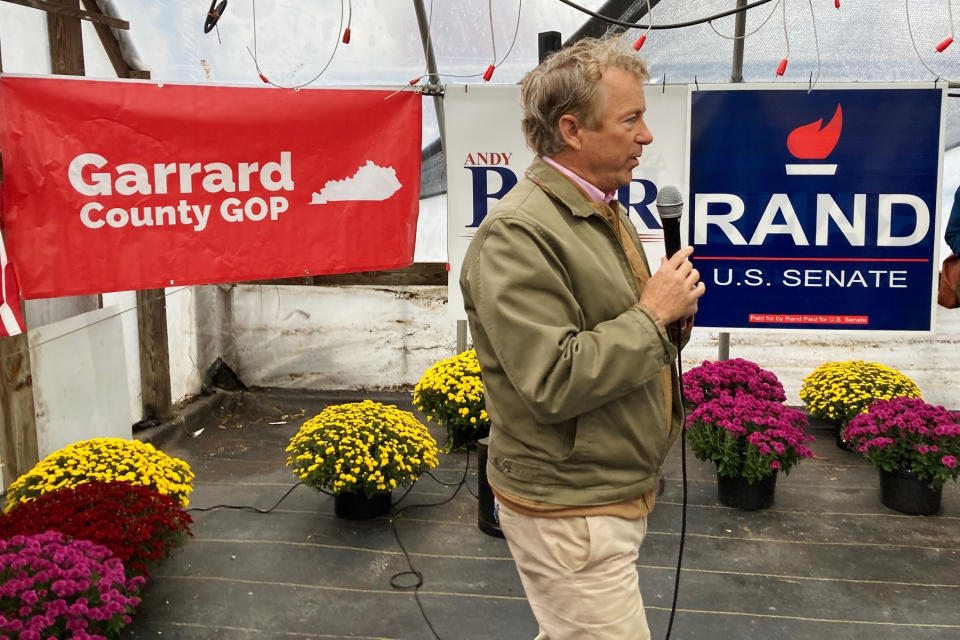 U.S. Sen. Rand Paul, R-Ky., right, chats with supporters at a fish fry in speaks at a GOP rally on Tuesday, Oct. 18, 2022, in Garrard County, near Lancaster, Ky. Paul is seeking a third term in next month's midterm election. (AP Photo/Bruce Schreiner)