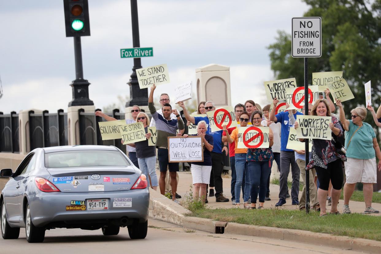 Janitorial workers, grounds workers and faculty members unite during a protest of Chancellor Andrew Leavitt of UW-Oshkosh considering outsourcing the grounds and janitorial work of the university to a private company out of Tennessee on Tuesday, Sept. 6, 2022, in Oshkosh, Wis. On Monday, Sept. 12, 2022, Chancellor Leavitt announced the university will not be outsourcing almost 100 jobs.