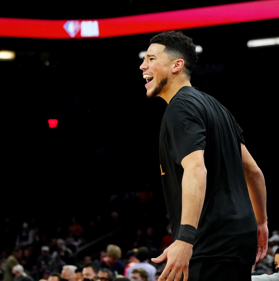 Jan 22, 2022; Phoenix, Arizona, USA; SunsÕ Devin Booker enters the court before a game against the Pacers at the Footprint Center. Mandatory Credit: Patrick Breen-Arizona Republic