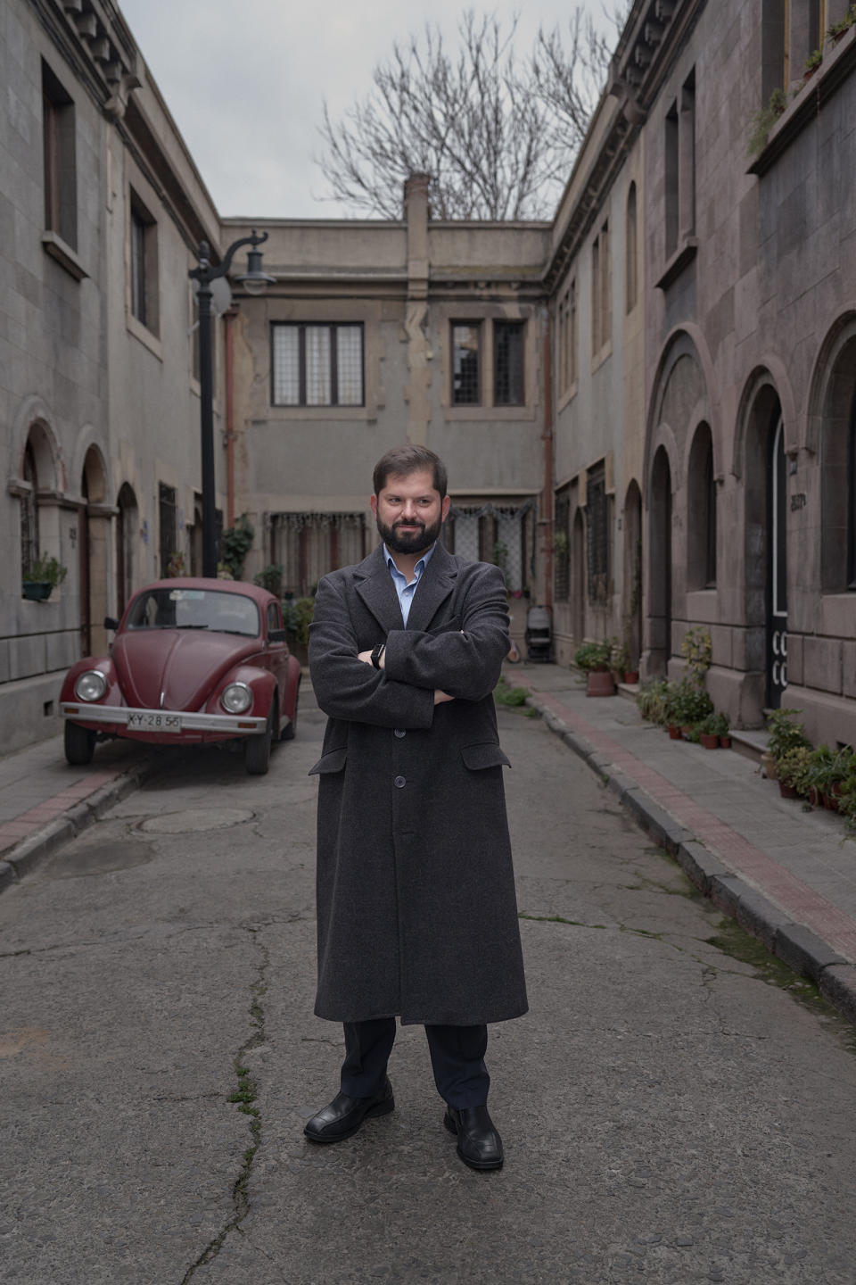 The president walks down a street in the Yungay neighborhood, Aug. 12. Boric settled in this historic and low income neighborhood of the city of Santiago after assuming presidency.<span class="copyright">Luján Agusti for TIME</span>