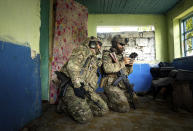 Ukrainian servicemen of "Fireflies" reconnaissance team operate a drone at their position at the frontline in Mykolaiv region, Ukraine, on Monday, Aug. 8, 2022. (AP Photo/Evgeniy Maloletka)