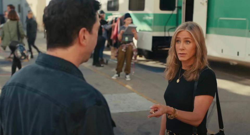 PHOTO: Jennifer Anniston speaks with Dave Schwimmer in the new Uber Eats Super Bowl commercial. (Uber Eats/YouTube)