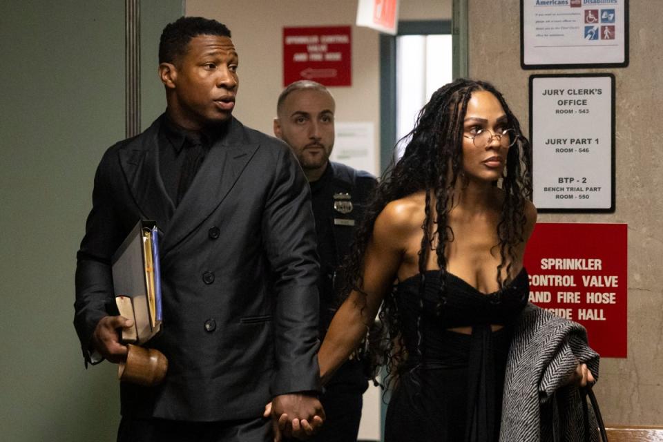 Actors Jonathan Majors, left, and Meagan Good arrive at court for a trial on his domestic violence case