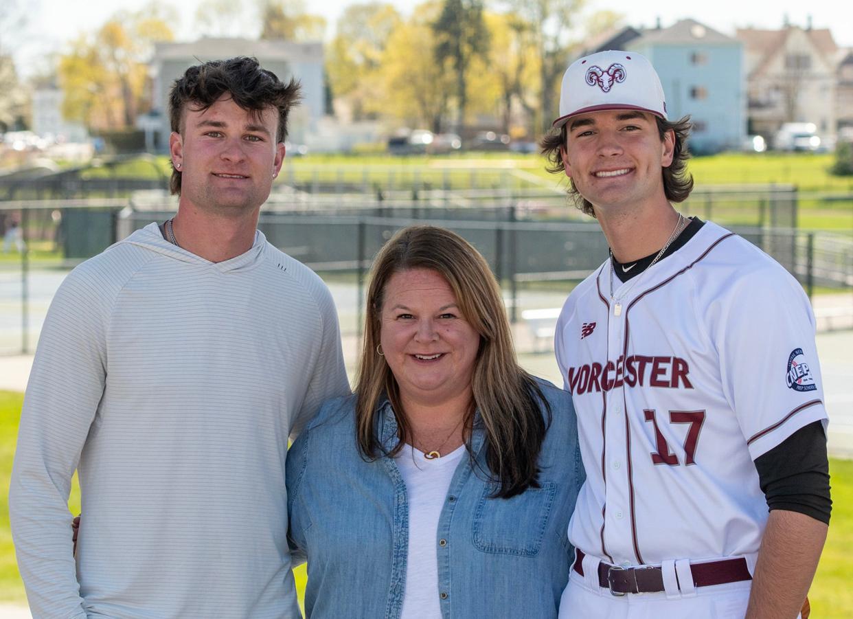Worcester Academy’s Mavrick Rizy, right, with his mother Kelly and brother Kyle at Gaskill Field in Worcester Friday.