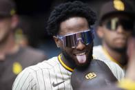 San Diego Padres Jurickson Profar (10) reacts after scoring during the seventh inning of a baseball game against Atlanta Braves, Sunday, May 15, 2022, in Atlanta. (AP Photo/Hakim Wright Sr)