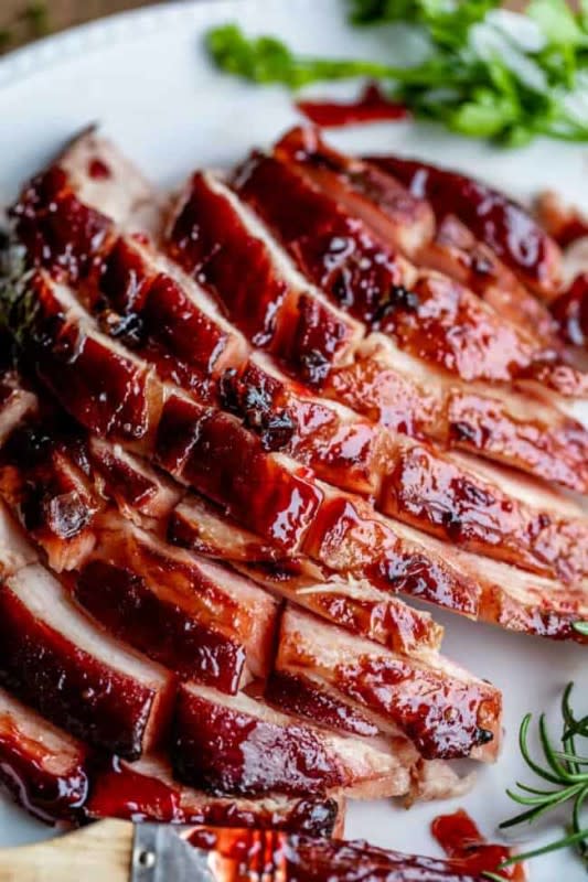 <p>The Food Charlatan</p><p>This raspberry chipotle glazed ham is the perfect combo of sweet and tart, with a bit of a smokey kick from the chipotle.</p><p><strong>Get the recipe: <a href="https://thefoodcharlatan.com/raspberry-chipotle-glazed-ham/" rel="nofollow noopener" target="_blank" data-ylk="slk:Raspberry Chipotle Glazed Ham;elm:context_link;itc:0;sec:content-canvas" class="link rapid-noclick-resp">Raspberry Chipotle Glazed Ham</a></strong></p>