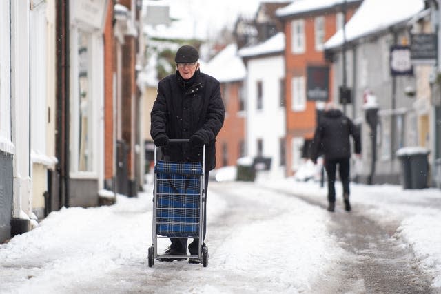 A man pushes his trolley through Woodbridge in Suffolk