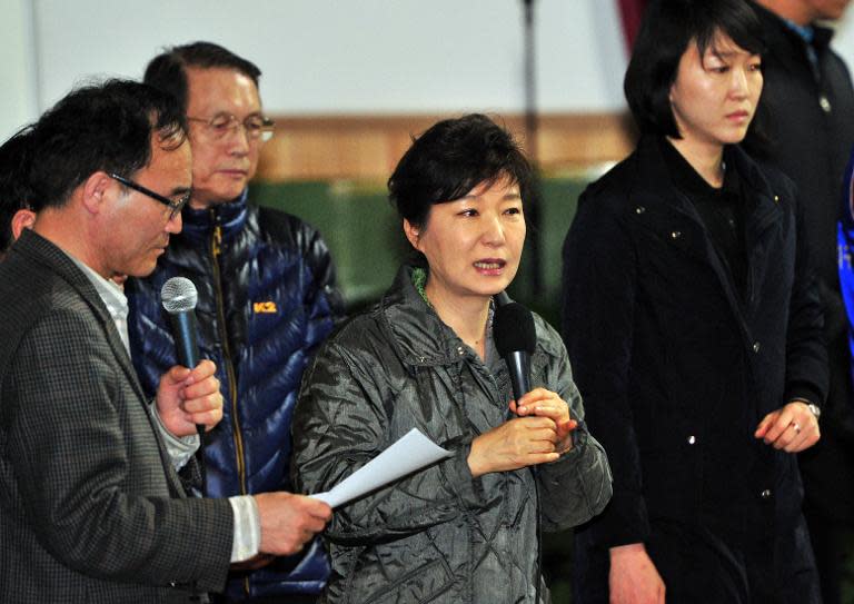 South Korea's President Park Geun-Hye (centre) speaks during a visit to relatives of missing passengers on board a capsized ferry as they wait for updates about their loved ones at a gymnasium in Jindo, on April 17, 2014