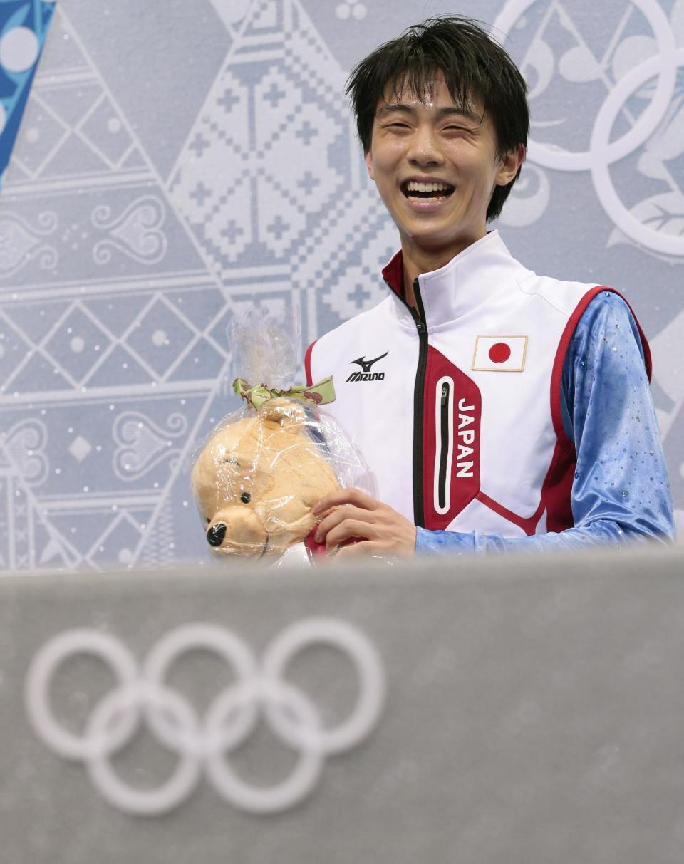 Yuzuru Hanyu of Japan waits for his results after competing in the men's short program figure skating competition at the Iceberg Skating Palace during the 2014 Winter Olympics, Thursday, Feb. 13, 2014, in Sochi, Russia. (AP Photo/Ivan Sekretarev)