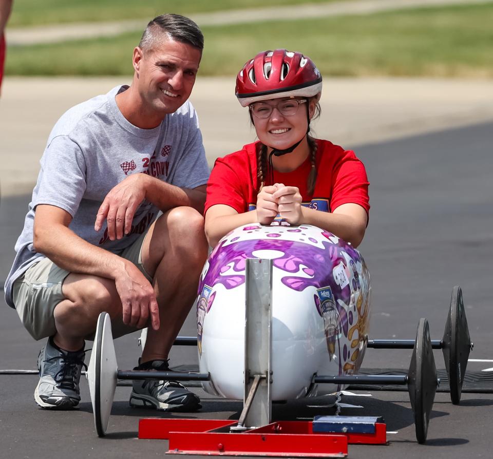 Some great father-daughter bonding time as Dave Brown and Meredith Brown take a minute to smile prior to the start of her race at the Wayne-Holmes Soap Box Derby.