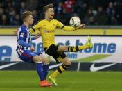 Football Soccer - Hertha Berlin v Borussia Dortmund - German Bundesliga - Olympiastadion, Berlin, Germany - 06/02/16 Borussia Dortmund's Marco Reus and Hertha Berlin's Mitchell Weiser in action REUTERS/Fabrizio Bensch