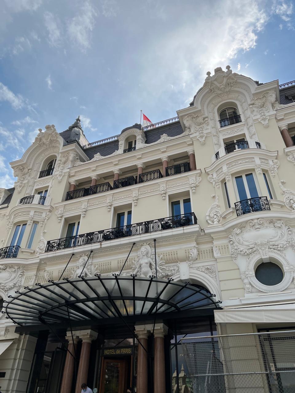 The exterior building, windows, and entrance to Hotel De Paris in Monte Carlo, Monaco.