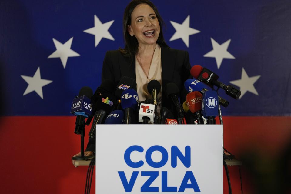 María Corina Machado, a former lawmaker and longtime government foe, speaks to the press in Caracas, Venezuela, Tuesday, Oct. 24, 2023. Machado continued to dominate the primary election held to pick the opposition's candidate to challenge Venezuelan President Nicolás Maduro next year, holding her support above 90% in the latest partial returns announced Monday. (AP Photo/Ariana Cubillos)